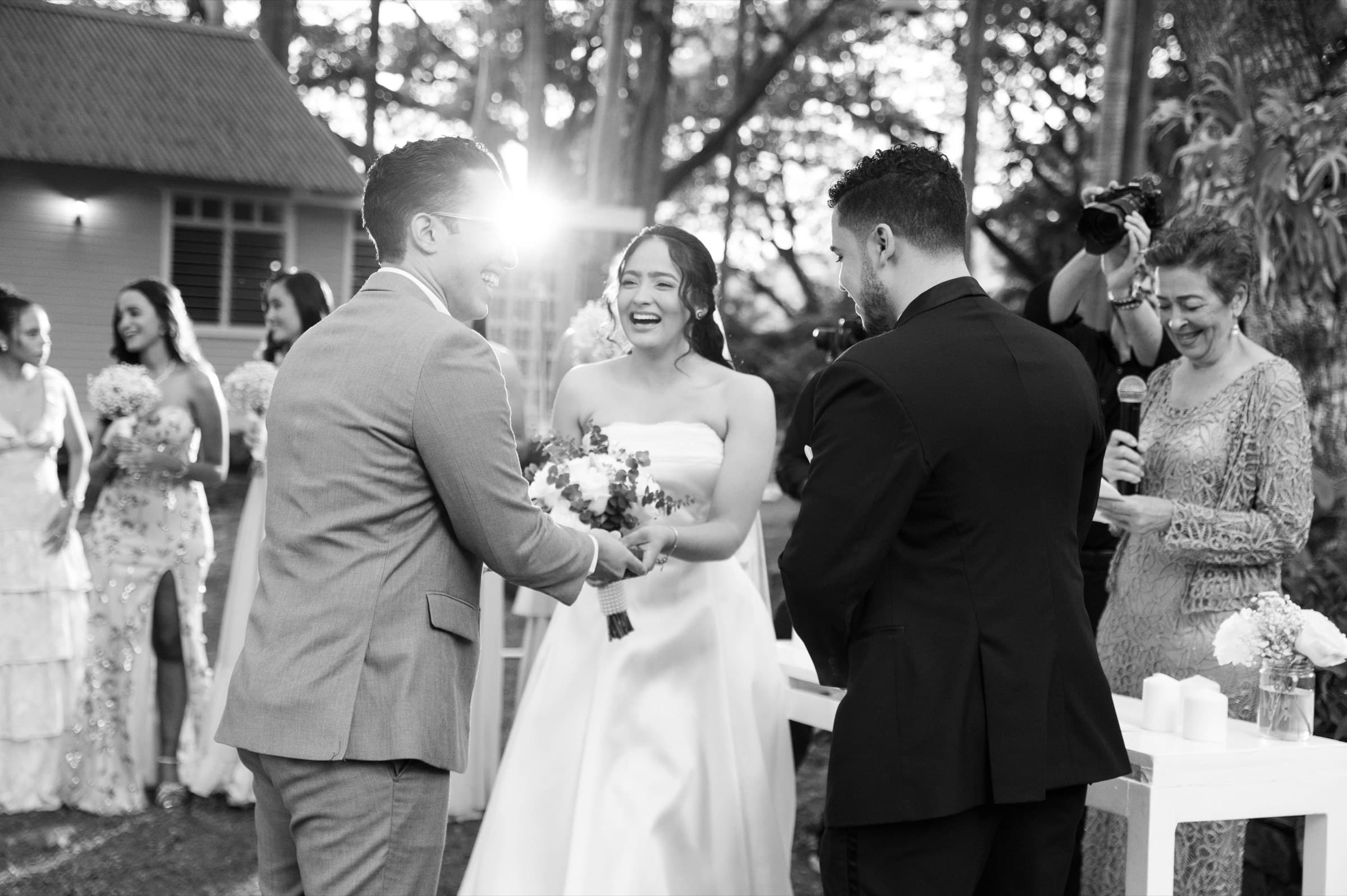 Zeta & Daniel laughing together during their ceremony